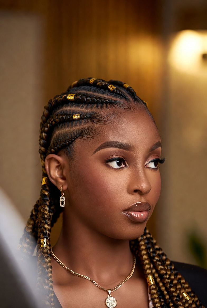 Fulani feed-in braids with gold cuffs